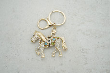 Брелок Кінь золотий металевий із білими стразами мікс