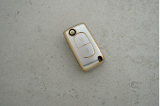 Чохол Peugeot сірий-золото поліуретан