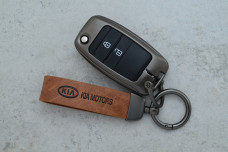 Чохол KIA сірий коричневий метал шкіра універсальний