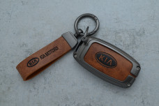 Чохол KIA сірий коричневий метал шкіра універсальний