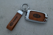 Чохол KIA коричневий метал шкіра універсальний