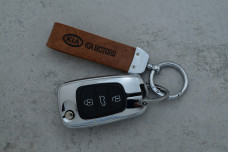 Чохол KIA коричневий метал шкіра універсальний