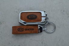 Чохол KIA коричневий метал шкіра універсальний