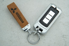 Чохол Mitsibishi коричневий метал шкіра універсальний