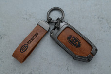 Чохол KIA сірий коричневий метал шкіра універсальний